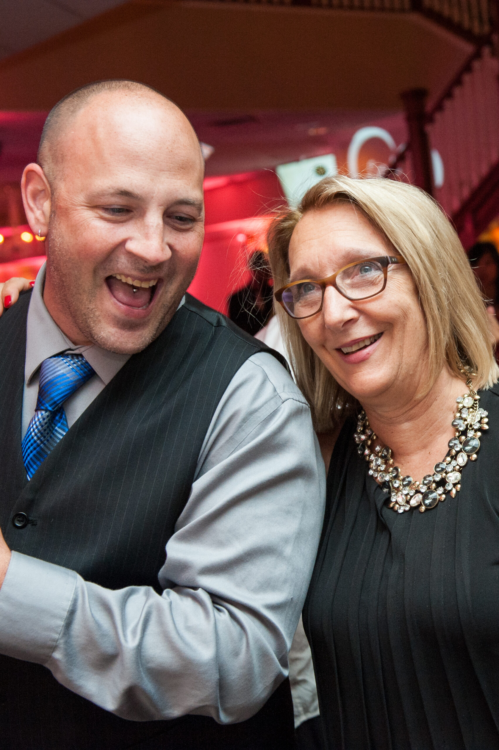 CT Wedding And Event DJ Dave Laughing With A Guest At Anthony's Oceanview in New Haven CT